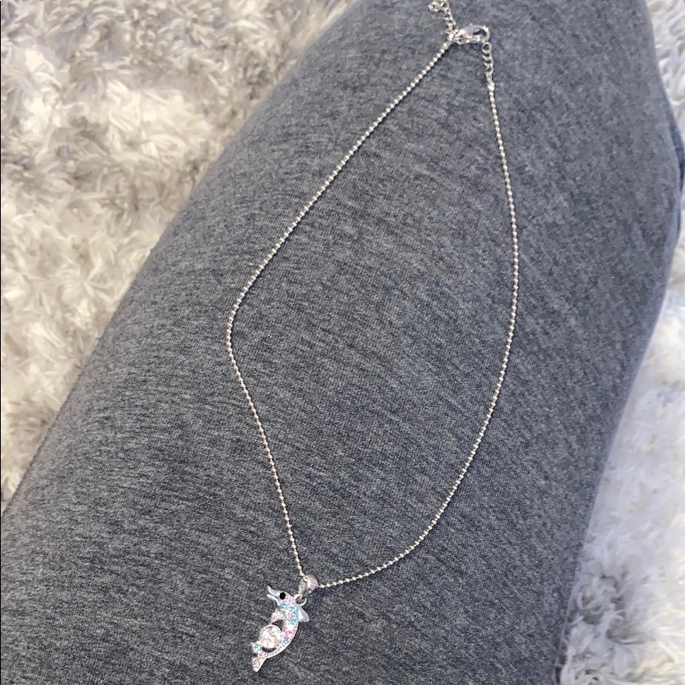 silver toned pink and blue dolphin necklace